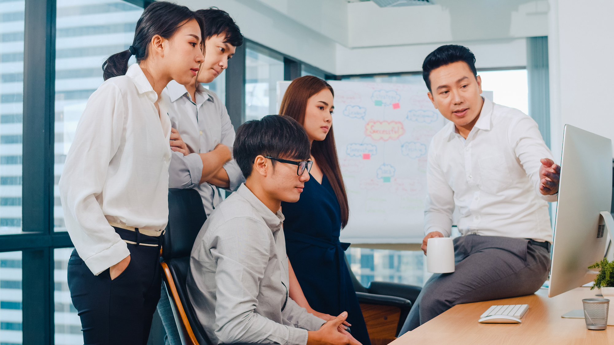 collaborative-process-multicultural-businesspeople-using-laptop-presentation-communication-meeting-brainstorming-ideas-about-project-colleagues-working-plan-success-strategy-modern-office